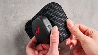 Hyperice Venom Go photographed ona grey background. 