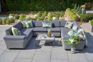 grey patio paving ideas with grey sofa