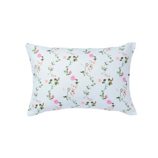Blue throw pillow with floral design