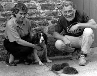 TV naturalist David Bellamy (right) with Judith Foster and her dog Lady on 30th September 1986. David had difficulty finding hedgehogs for his television programme "Bellamy's Bugle" but Lady came to the rescue after rooting out some from the nearby woods. (Photo by NCJ Archive/Mirrorpix/Getty Images)