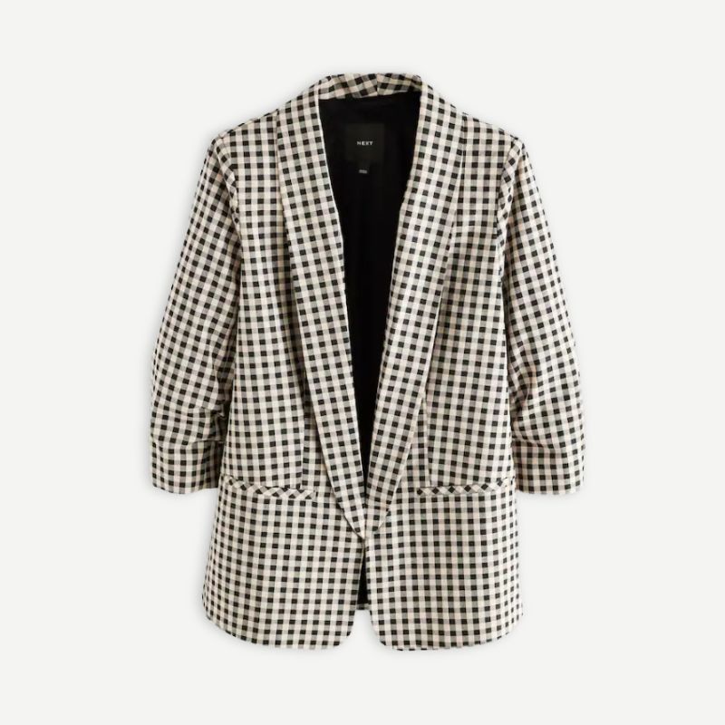 A cutout of a gingham blazer by Next