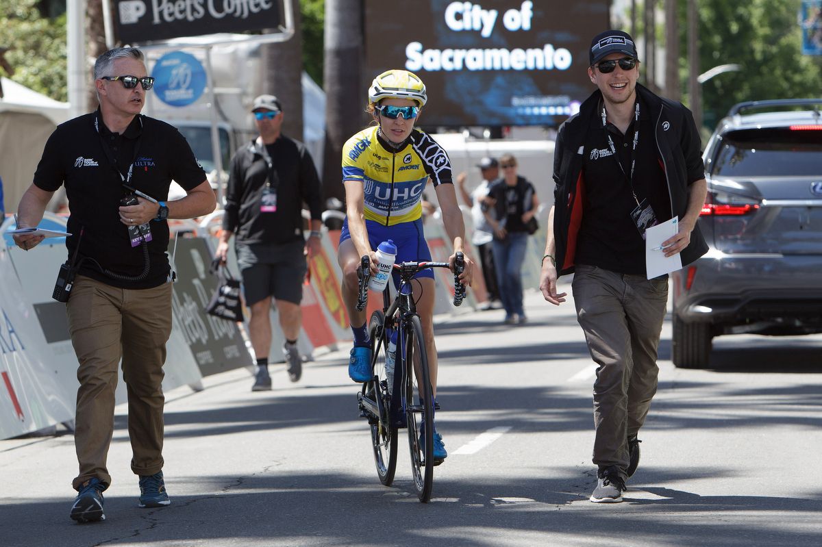 Katie Hall (UHC) is directed to the podium after the stage