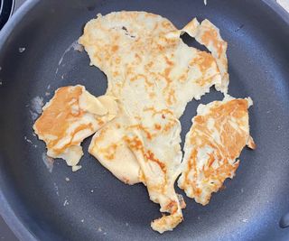 Lakeland Stainless Steel Pan Set making a pancake