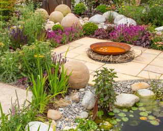 A contemporary backyard with rock garden elements