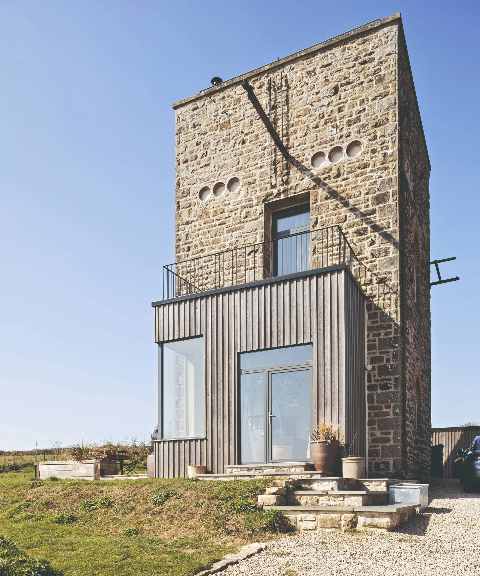 Exterior view of the house with timber cladded extension 