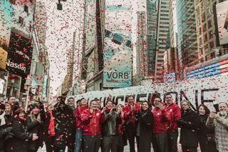 Virgin Orbit employees celebrate the company's debut on the NASDAQ stock exchange on Jan. 7, 2022.