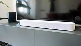 White Sonos Beam Gen 2 soundbar sitting in front of TV