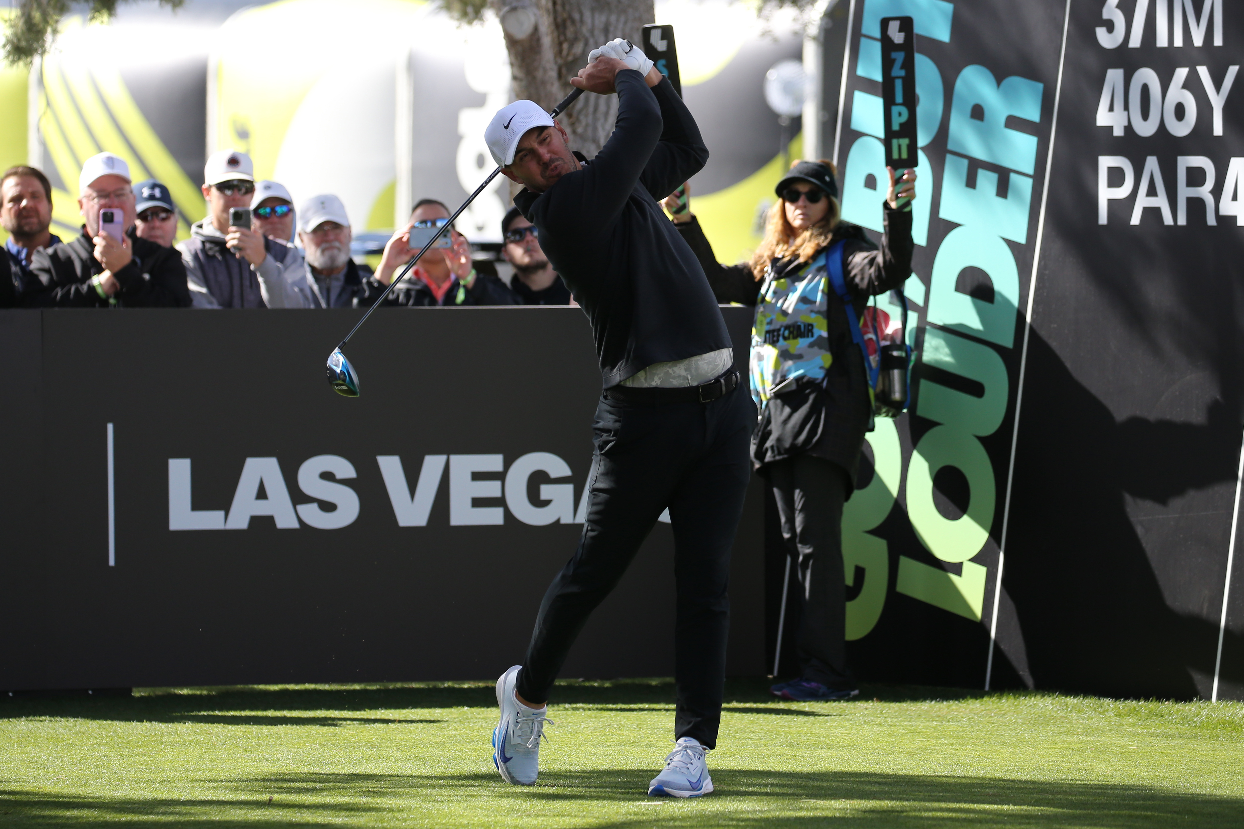 Brooks Koepka hits a tee shot at LIV Golf Invitational Las Vegas