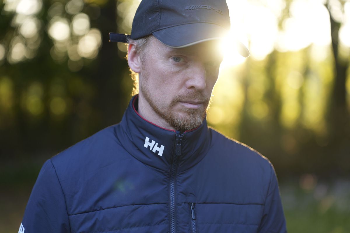 A man at golden hour, illuminated by the sun, natural background