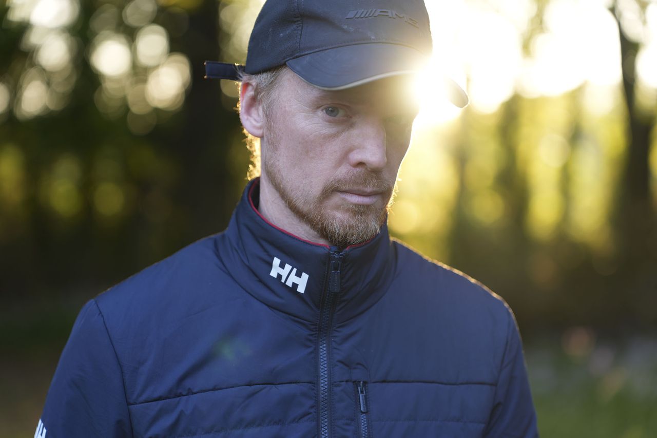 A man at golden hour, illuminated by the sun, natural background