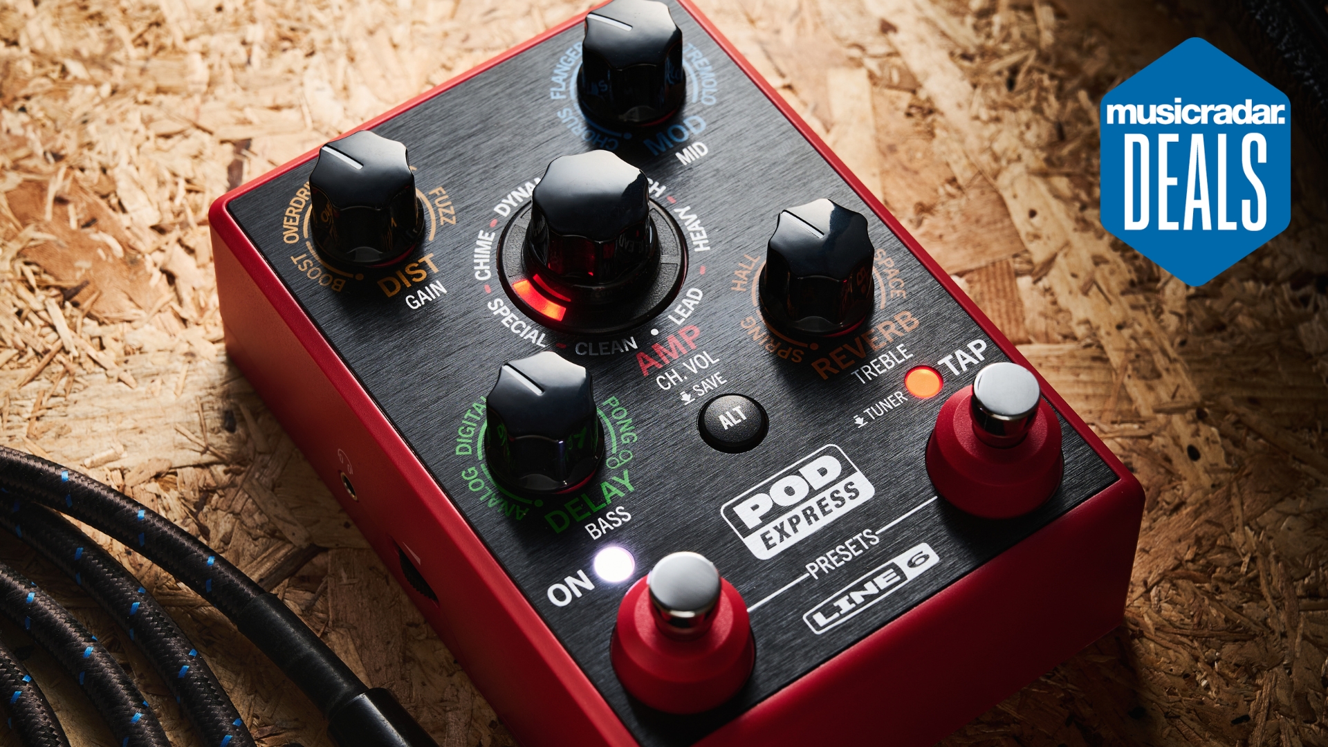 Close up of a Line 6 POD Express multi-effects pedal on a piece of hardwood with the MusicRadar deals logo in top right