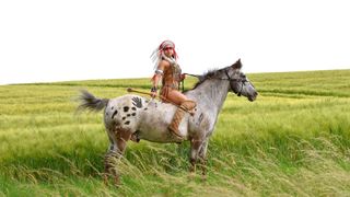 Native American indian woman on her pony