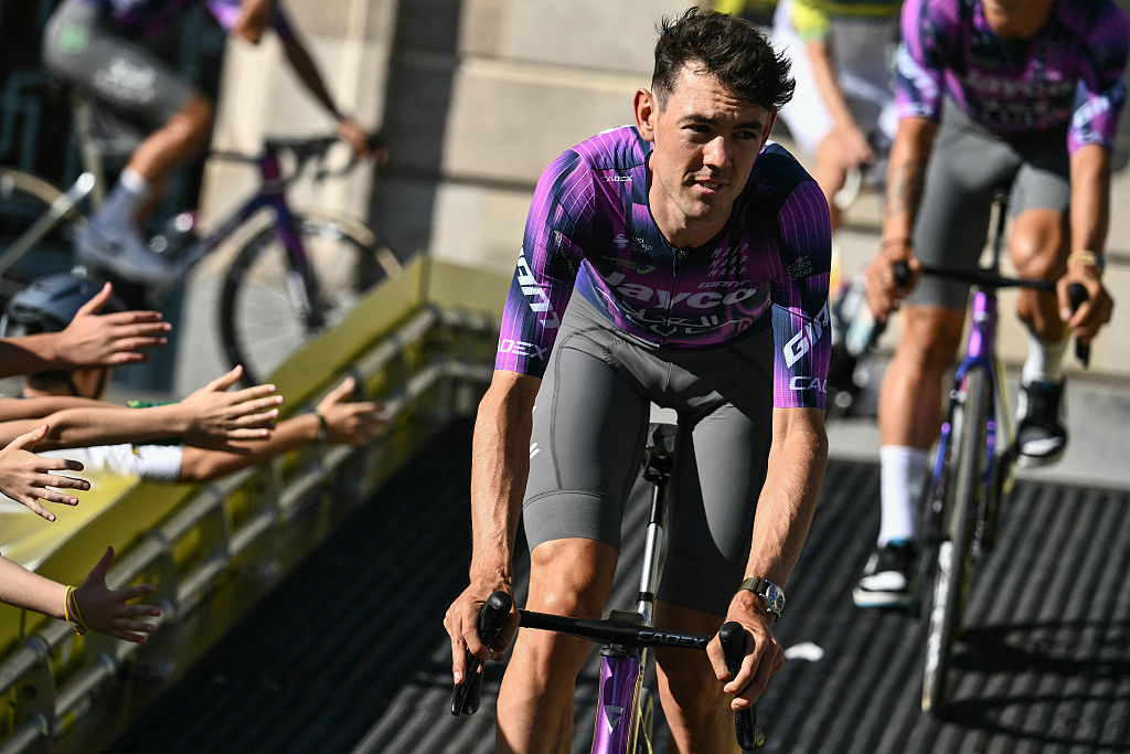 Team Jayco AlUla team's Australian rider Ben O'Connor cycles through Lille's city center during the official teams presentation days prior to the start of the 112th edition of the Tour de France cycling race, in Lille, northern France, on July 3, 2025. (Photo by Marco BERTORELLO / AFP)