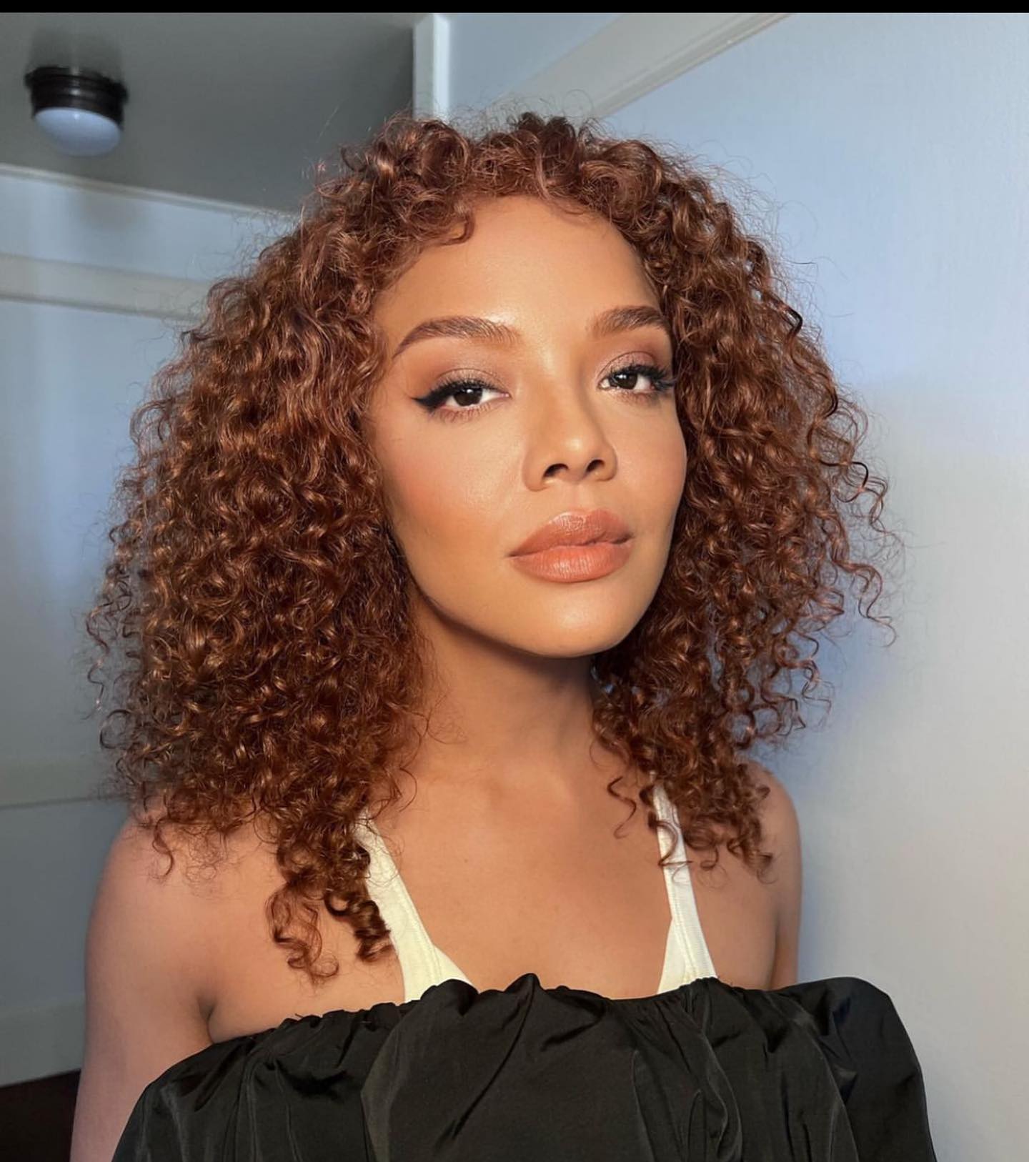 Tessa Thompson with copper hair