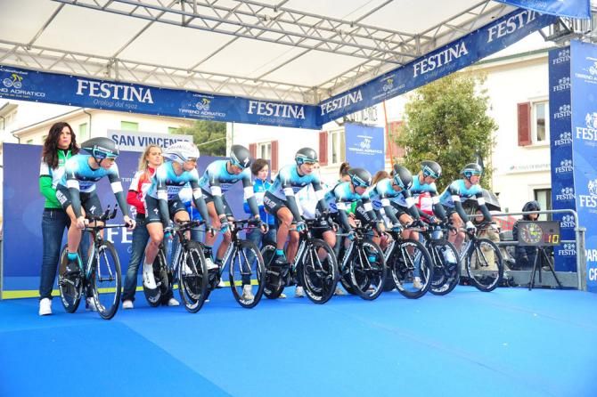 Omega Pharma-Quick Step team members eye the countdown clock at the start of the team time trial.