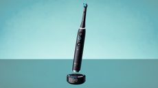 Oral-B iO10 electric toothbrush on green background