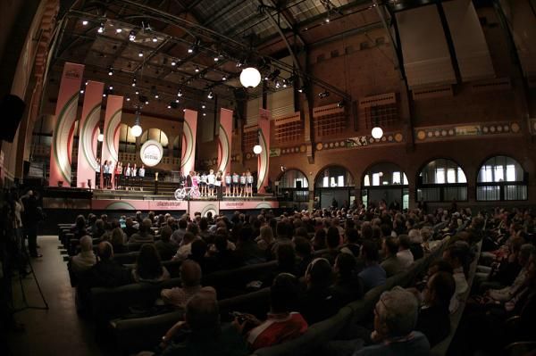 Team Milram is a spec from the back of the Beurs van Berlage