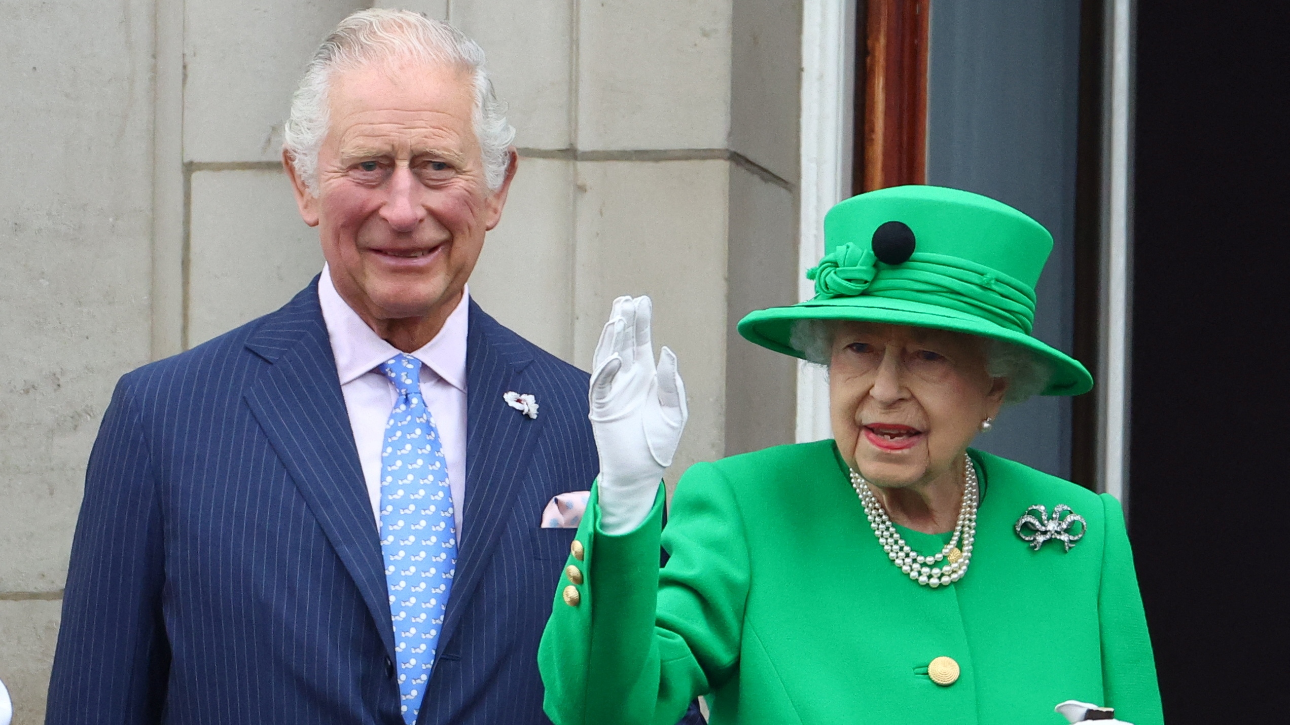 King Charles and Queen Elizabeth stand on a balcony during the Platinum Jubilee Pageant on June 05, 2022