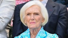 Dame Mary Berry, wearing a blue and white dress, attends day five of the Wimbledon Tennis Championships 2025