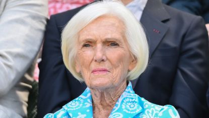 Dame Mary Berry, wearing a blue and white dress, attends day five of the Wimbledon Tennis Championships 2025