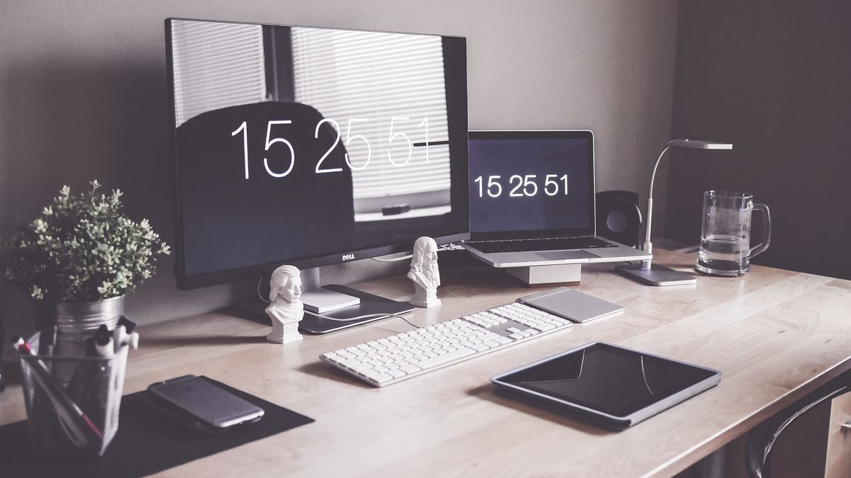 series of Apple devices on a desk