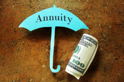 Hundred dollar bill under a paper umbrella with Annuity text 