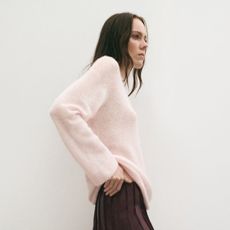 model wearing black Zara coat