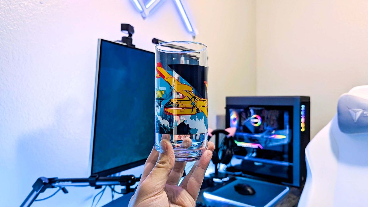 An Xbox x IHOP collectible glass held in a hand, featuring unique art from Microsoft Flight Simulator 2024.