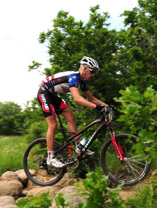 Max Plaxton (Sho-Air/Specialized) with a small lead on lap three.