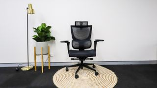 The ErgoTune Supreme V3 office chair on a round rug
