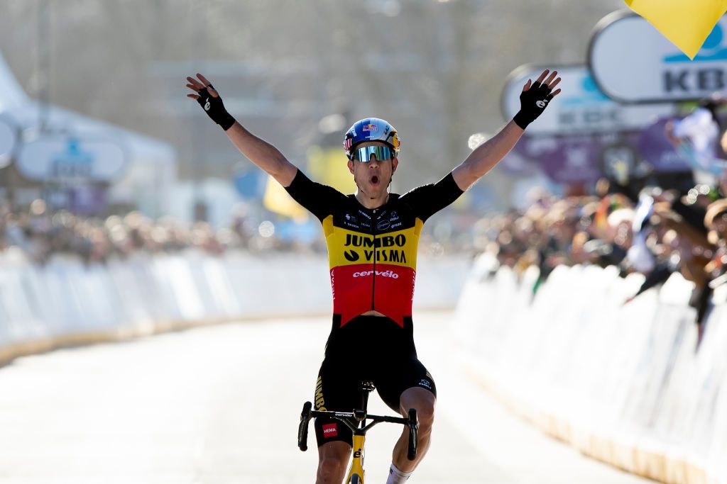 Belgian Wout Van Aert of Team JumboVisma celebrates as he crosses the finish line to win the mens elite race of the Omloop Het Nieuwsblad oneday cycling race 2042km from Gent to Ninove Saturday 26 February 2022 BELGA PHOTO KRISTOF VAN ACCOM Photo by KRISTOF VAN ACCOMBELGA MAGAFP via Getty Images