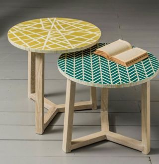 inlaid side tables with book and geometric print