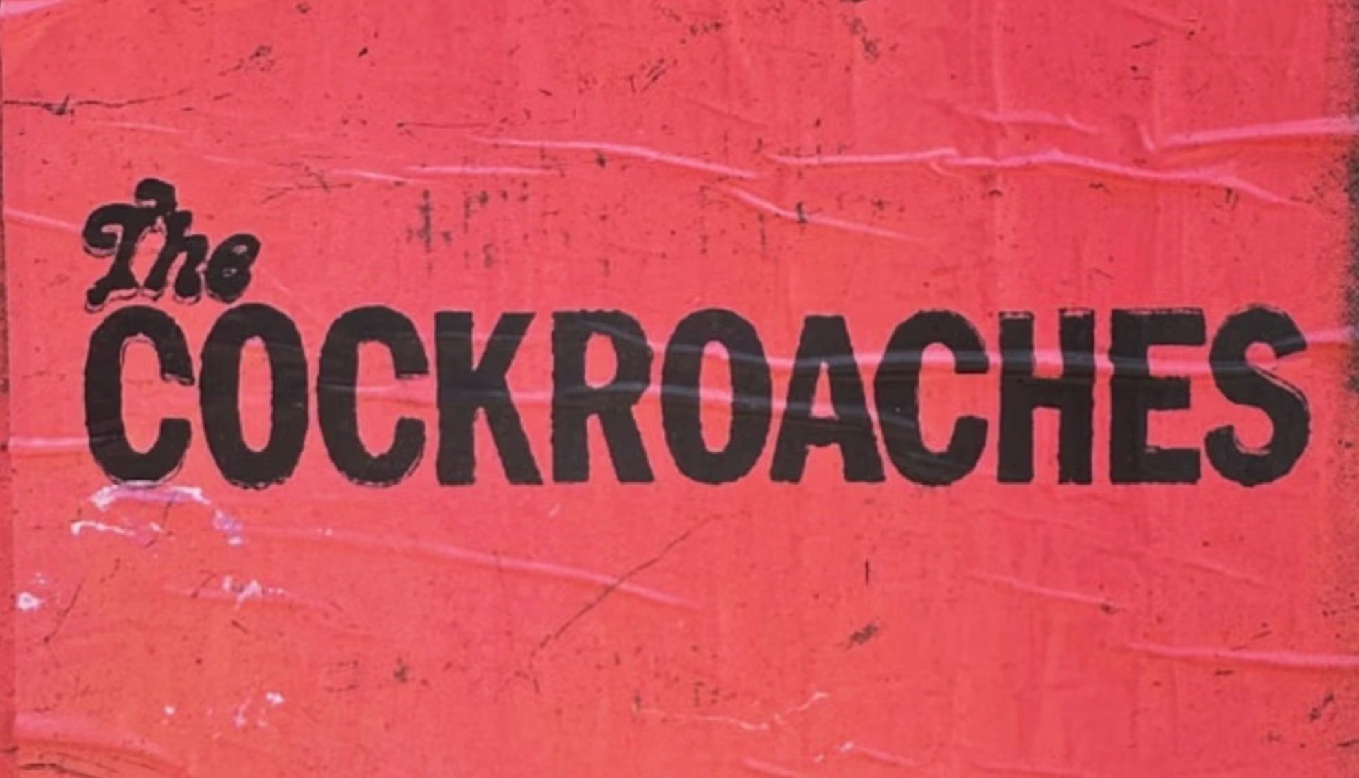 The word Cockroaches on a red poster