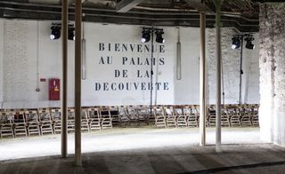 (welcome to the palace of discovery) was spelt out in black stencilled letters on the walls of the Grand Palais' stables, The cavernous space featured rough elements such as steel structures and crumbling walls.