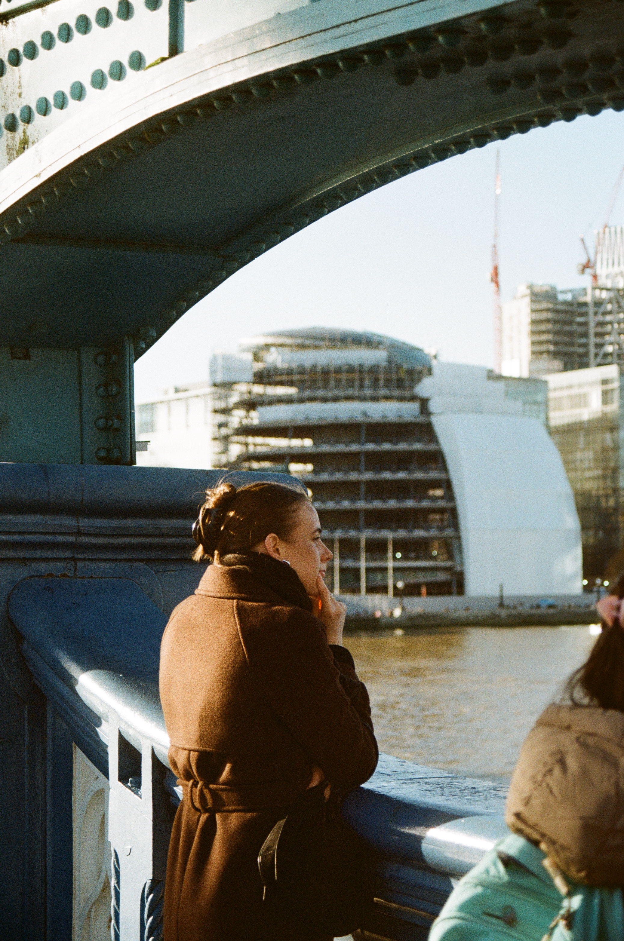 Sample image of Kodak Kodacolor 100 showing woman in brown coat looking out from London's Tower Bridge