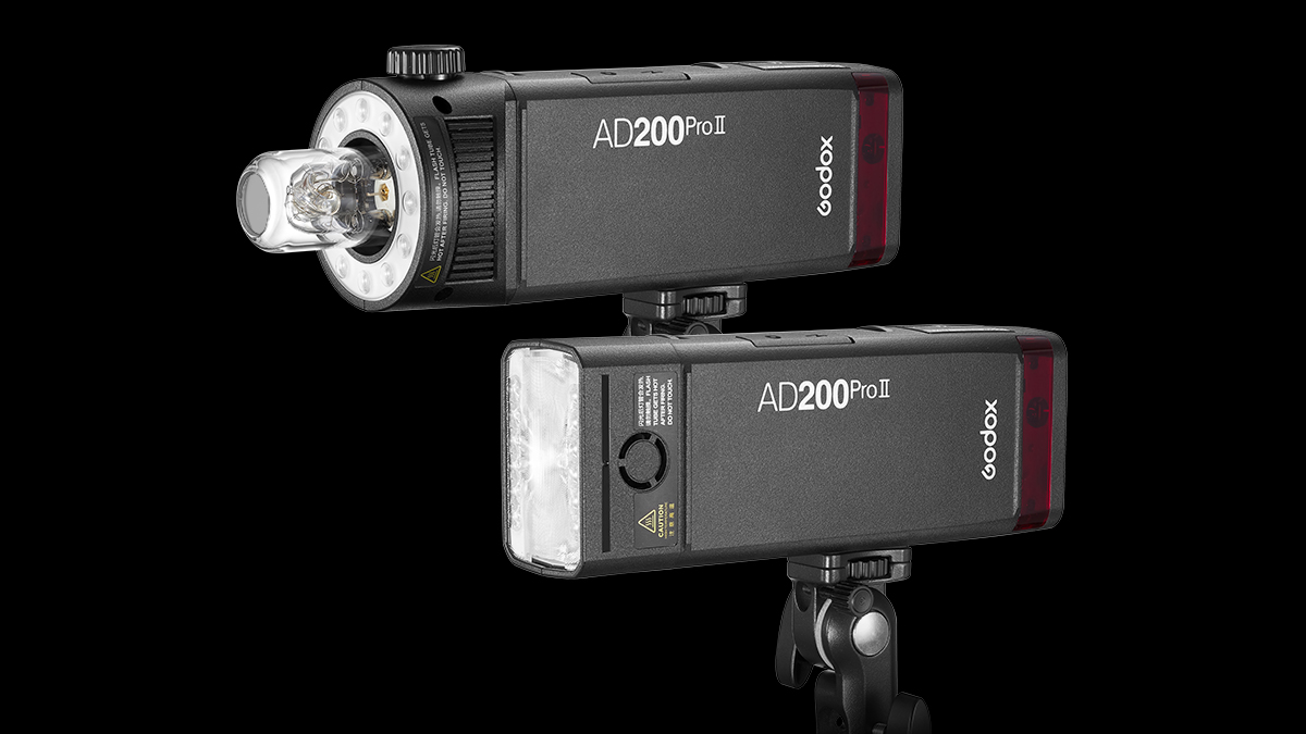 Two Godox AD200 Pro II lights, one with the speedlite flash head and one with the bulb