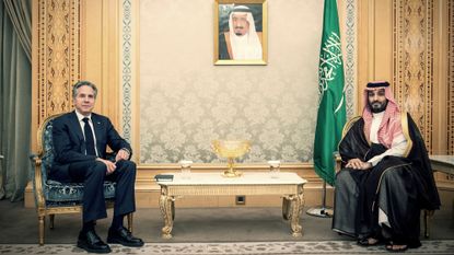 Secretary of State Antony Blinken and Saudi Crown Prince Mohammed bin Salman pose in chairs