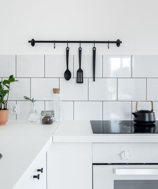 A kitchen with tiles walls