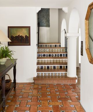 entrance hall with original hand painted tiled stairs