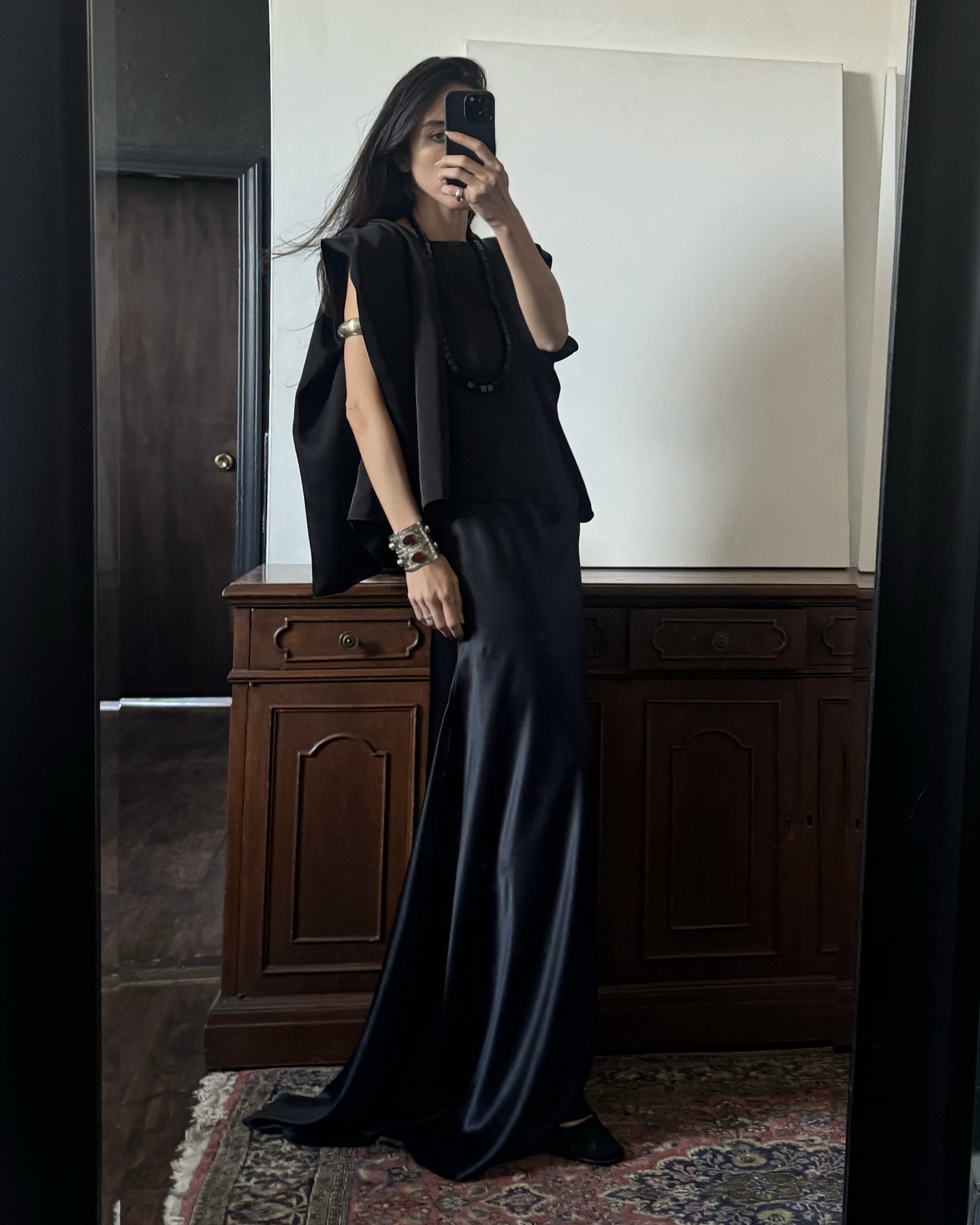 Alexis Badiyi wearing a silk skirt and a silk blouse