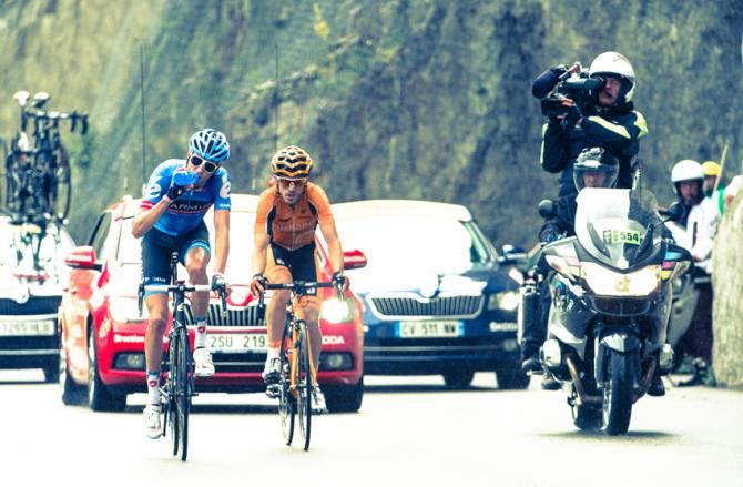 Jon Izaguirre Insausti rides ahead of Ryder Hesjedal in the first break over the Col du Glandon