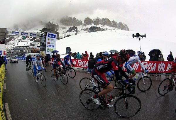 Rides finish the final stage of the Giro del Trentino on the snowy summit of the Passo Pordoi.