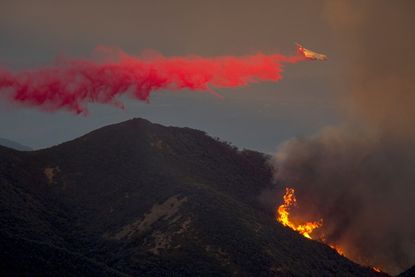 A plane drops fire retardant on the Sherpa fire in Santa Barbara County, California.