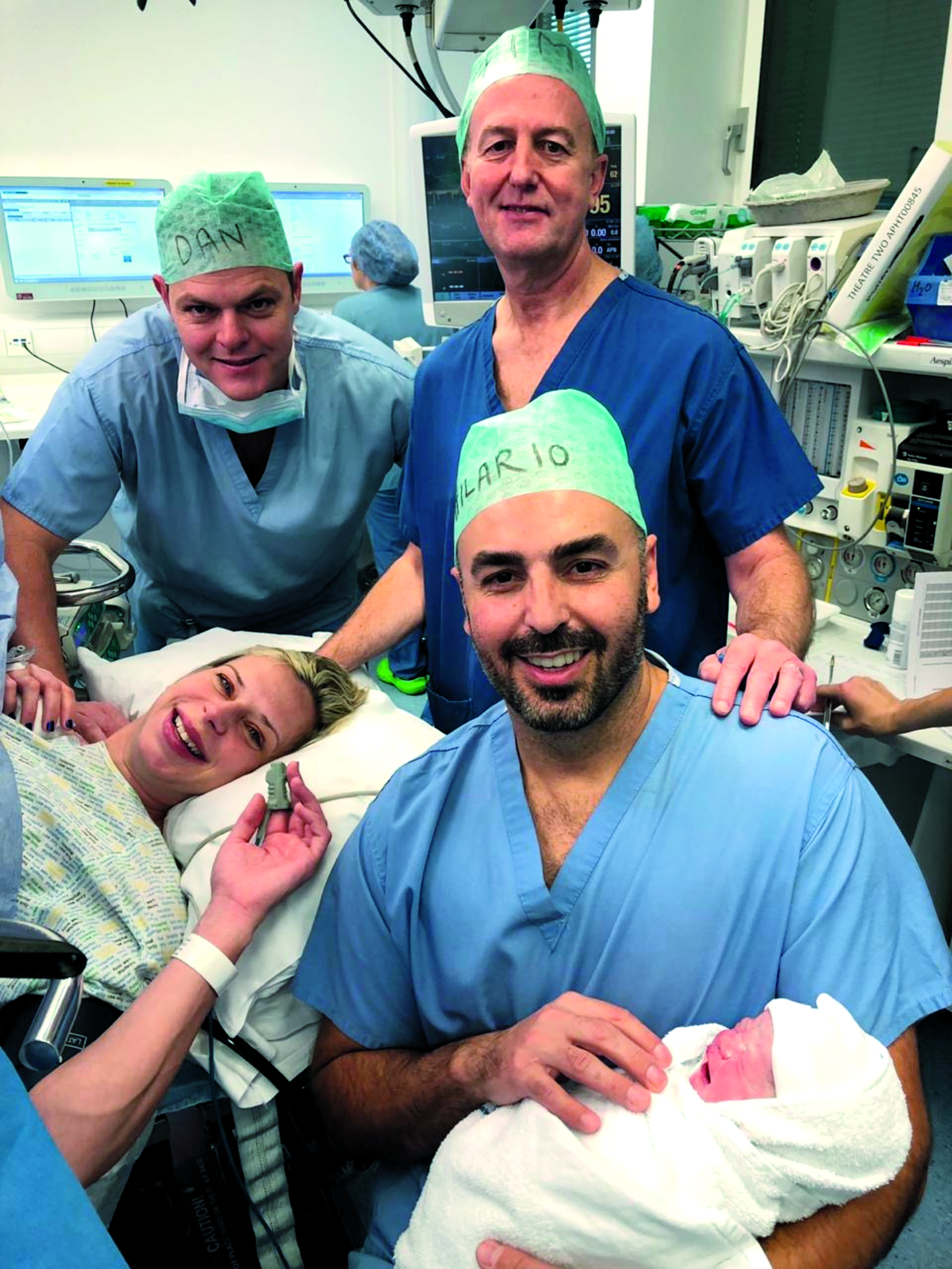 Karina Ward post-labour with husband Tim, Daniel, and Hilario