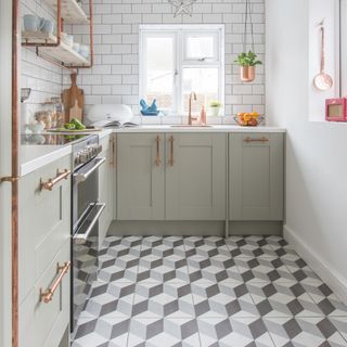 Green narrow kitchen with patterned floor