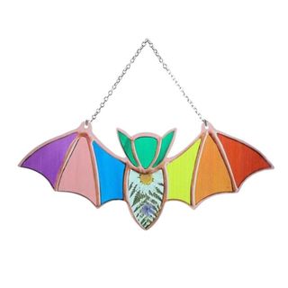 A hanging bat decoration with rainbow wings