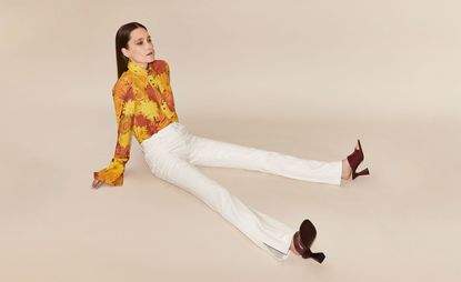 Model wearing yellow top and white pant