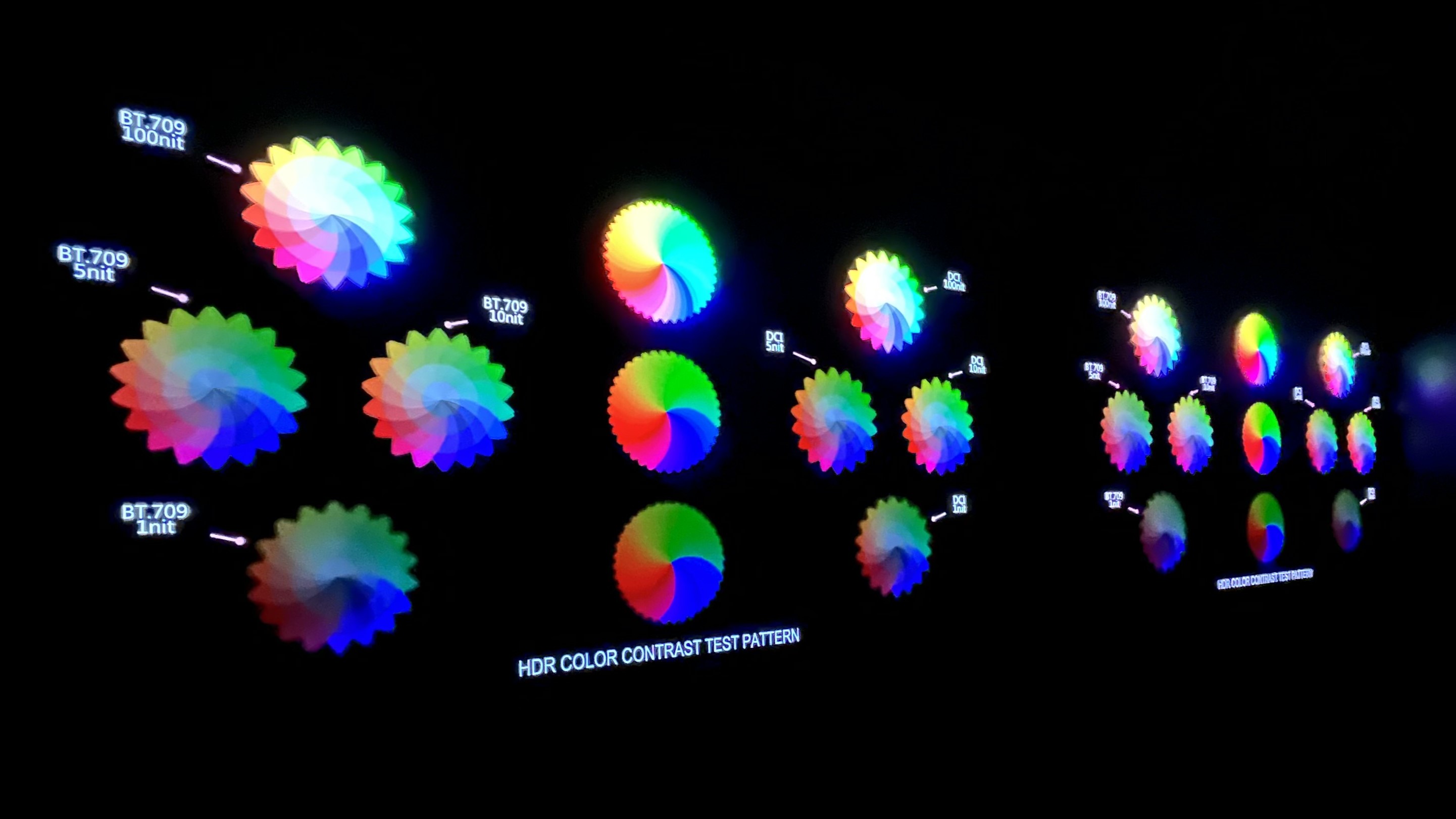 LG G4  and Samsung S95D OLED TVs side by side displaying test pattern