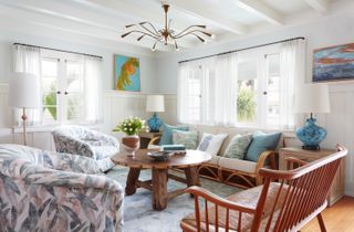 A living room with green and blue decor