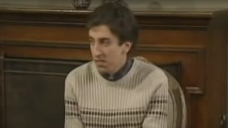 Simon Helberg in a sweater frowning on MADtv